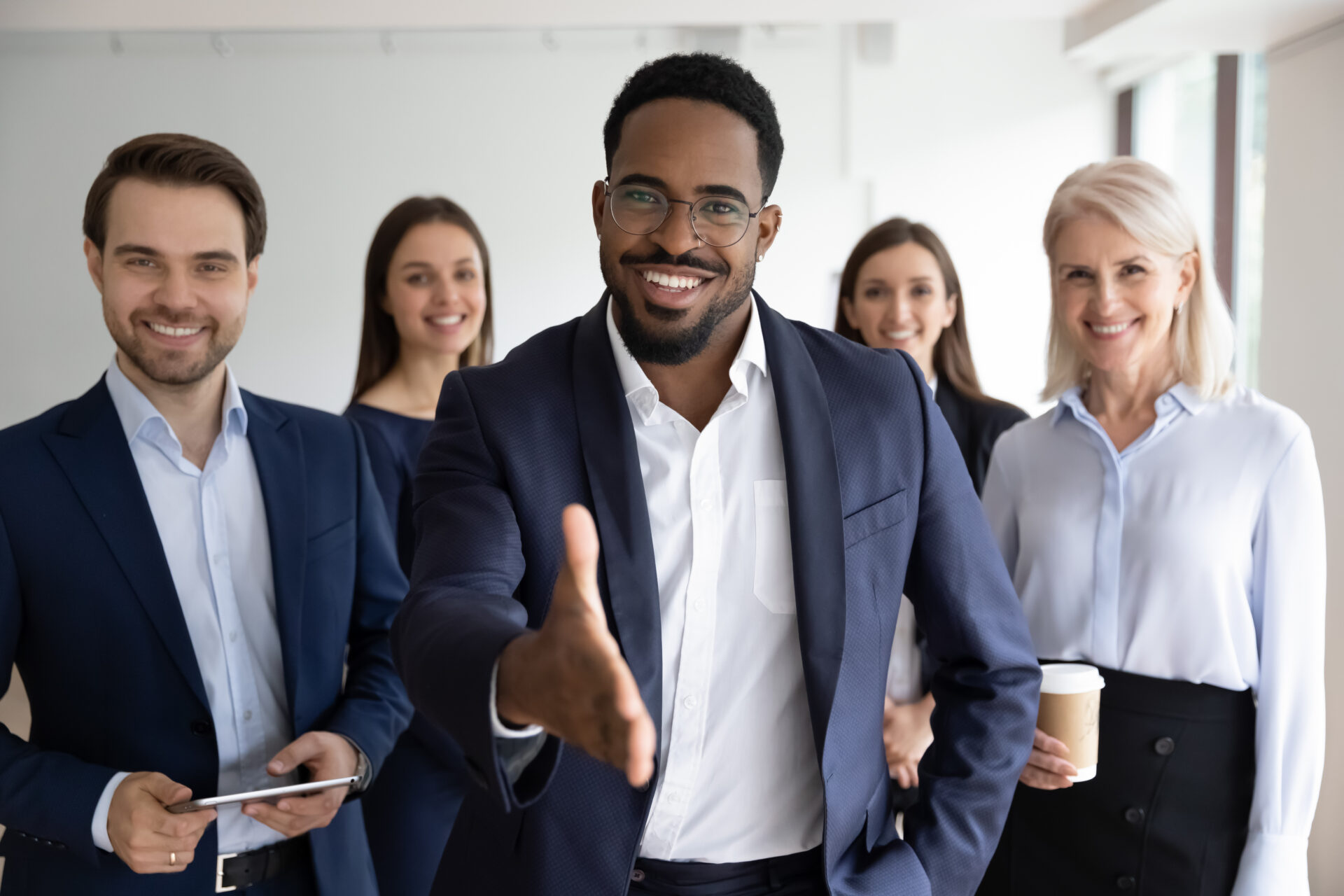 Portrait,Of,Smiling,African,American,Team,Leader,Stretch,Hand,Greeting