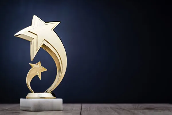 Elegant,Gold,Winners,Trophy,With,Shooting,Stars,To,Be,Awarded