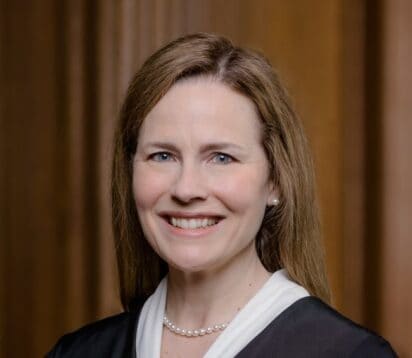 Portrait of a smiling woman in professional attire at NYCLA event.