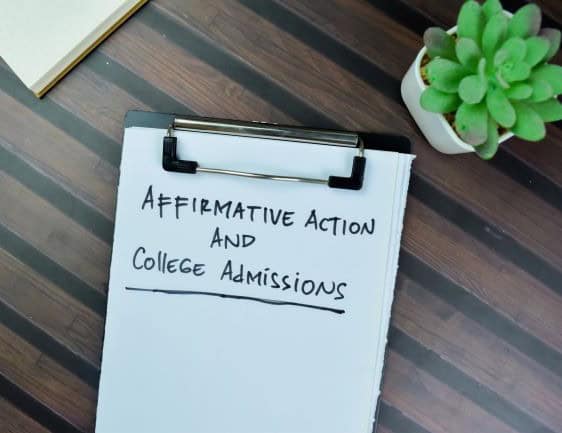 Notebook with 'Affirmative Action and College Admissions' written on it.